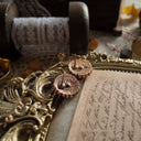 ALT Text: The reverse side, showing the signature scrollwork texture of 1928 Jewelry, as well as areas of natural darkening, defining its authentically aged character.