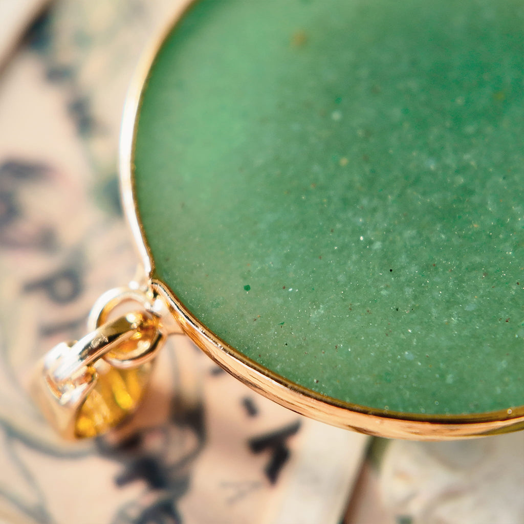 The reverse side of the upcycled Green Aventurine charm, showcasing the clean bezel setting and the quality of the handcrafted assembly.