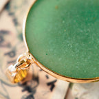 The reverse side of the upcycled Green Aventurine charm, showcasing the clean bezel setting and the quality of the handcrafted assembly.