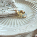 The Glimmering Pond Frog Pendant