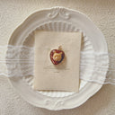 The Ruby Whisker Echo Pendant