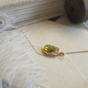 The Golden Seed Pendant