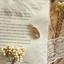 The Glimmering Grin Marquise Pendant