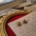 The reverse side, showing the authentic "ART ©" signature, as well as the significant wear and plate loss on the original earring backs.