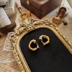 The matte gold clip-on earrings are shown from different angles, allowing for easy observation of the thickness and the gold plating condition on the sides.