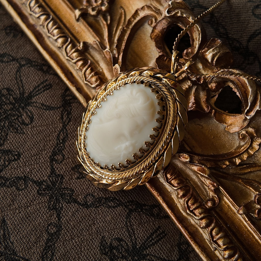 Vintage portrait pendant necklace, featuring an elegant woman's profile and exquisite carving.