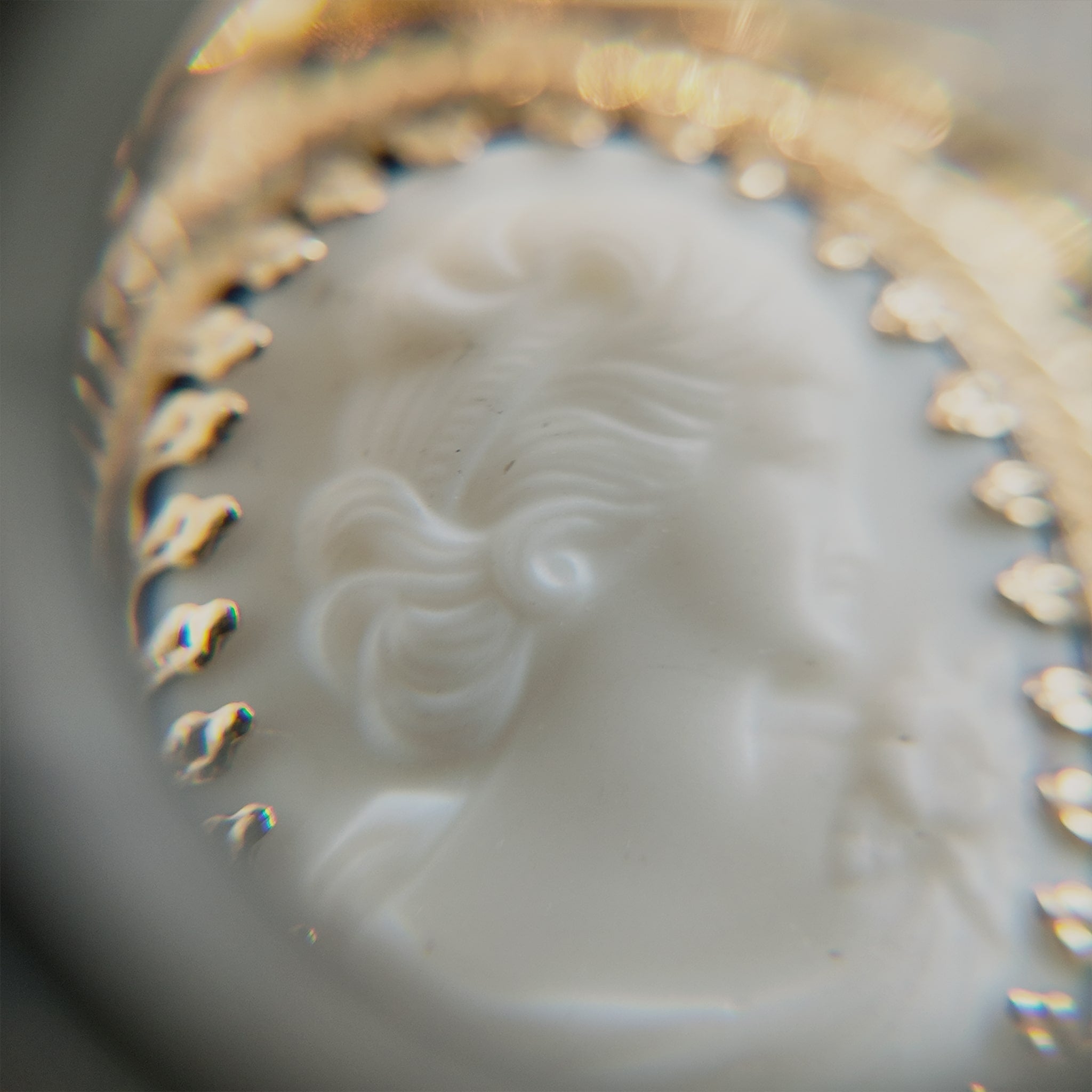 Details of vintage carved jewelry; stone carving techniques dating back to the 1940s.