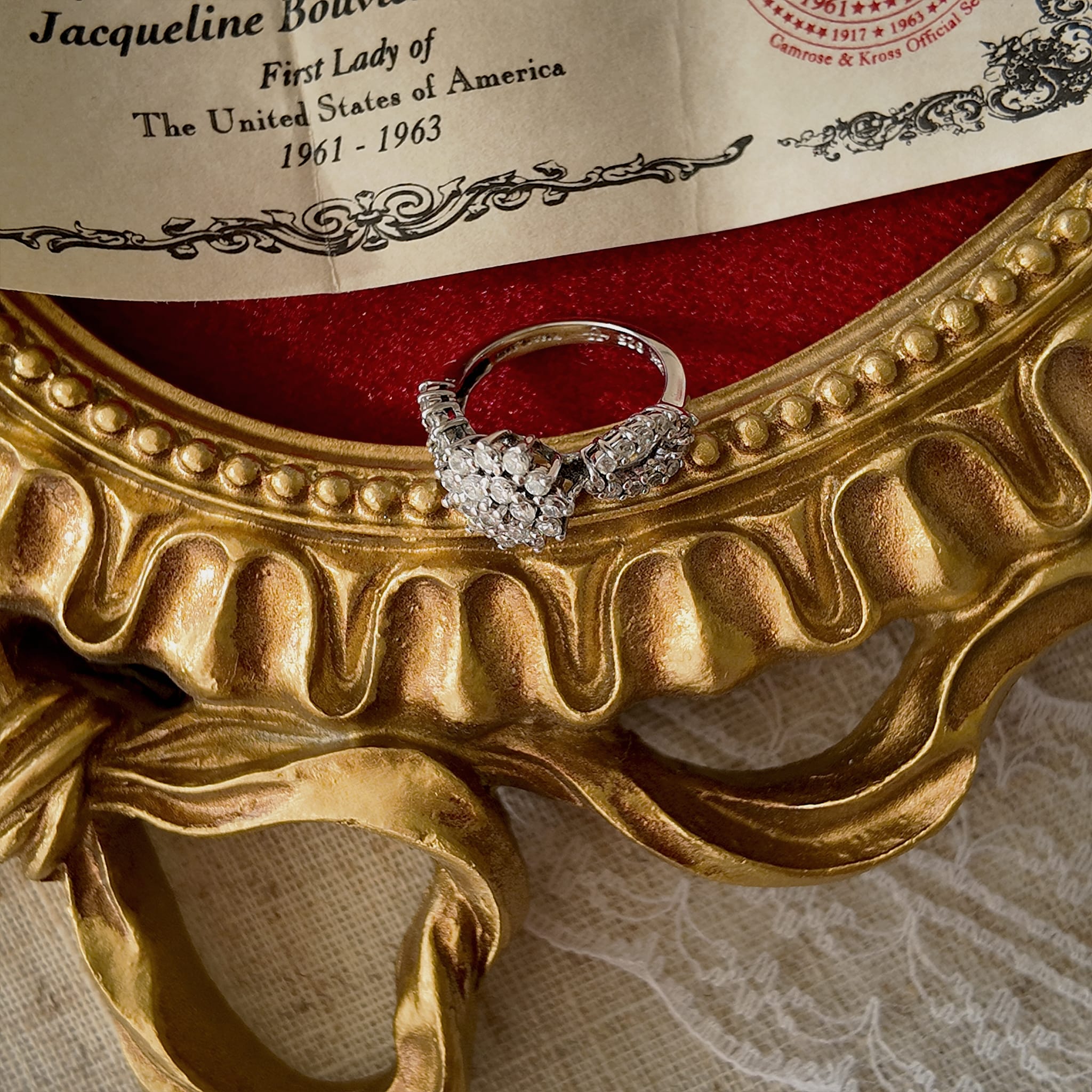 Lay the ring flat to show its full view from top to bottom, including the design of the band.