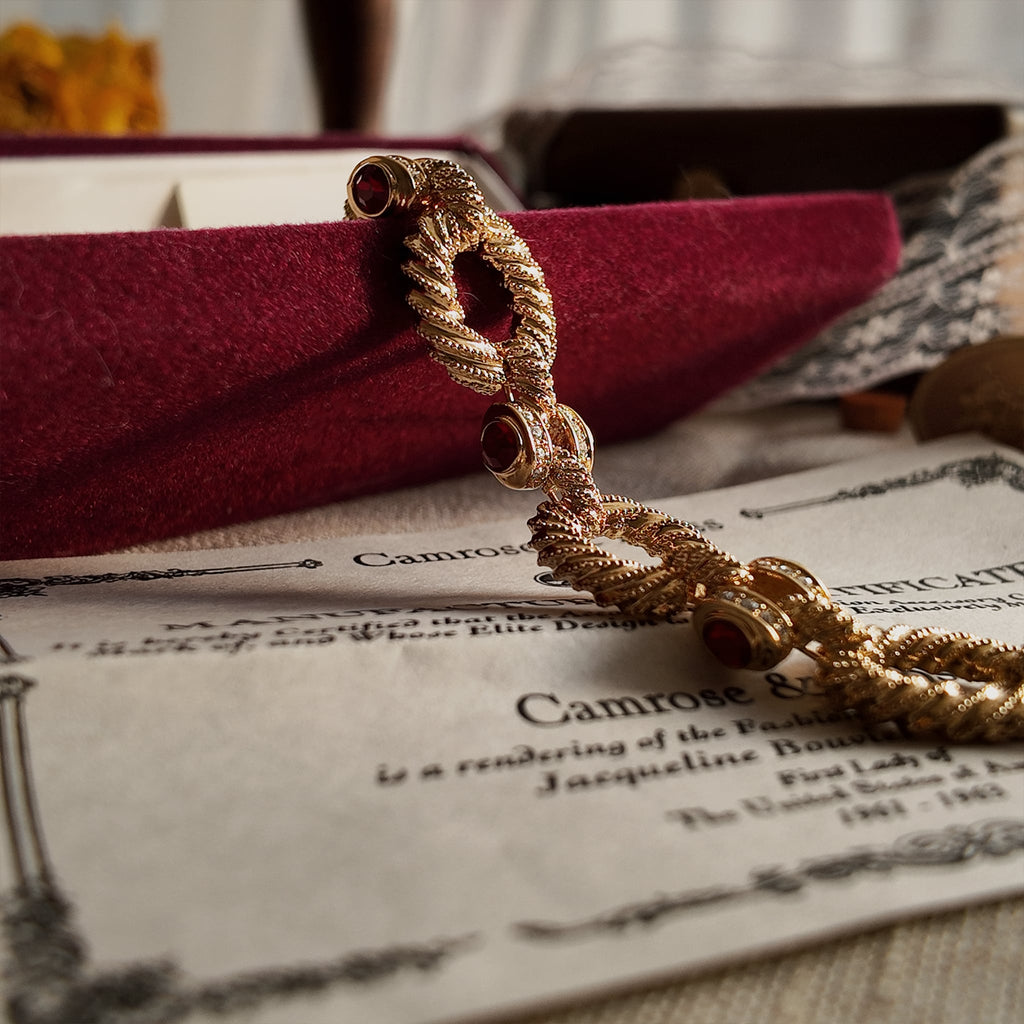 The gold bracelet was displayed suspended in the air, along with the bottom of the original red velvet box, appearing as if it were brand new.