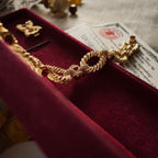 Showcasing the luster of the gold bracelet under sunlight, as well as details of the original box.