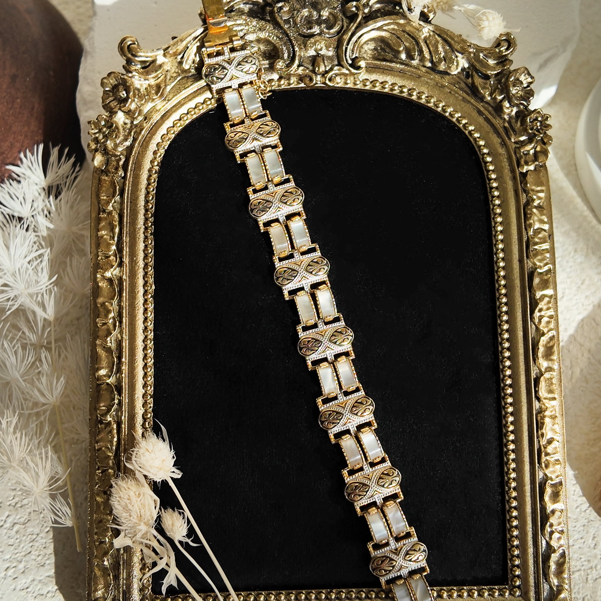 The gold Damask bracelet was stretched out to show what it looks like when not being worn.