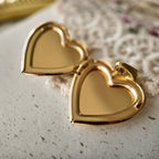 This is what the gold heart-shaped photo box pendant looks like when it's open; it's a pendant where you can put photos inside.