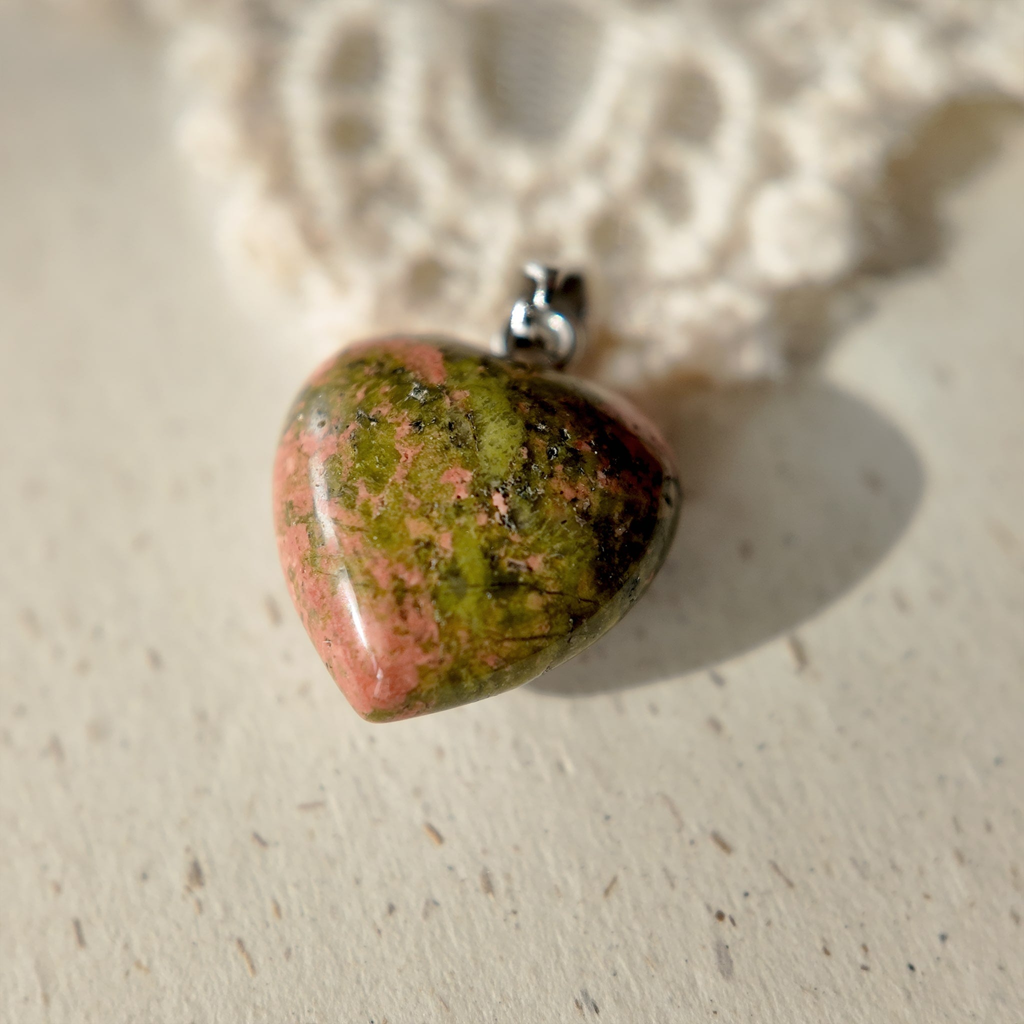 Natural stone pendants, green stones, pink stones. Genuine stone pendants with unique colors.