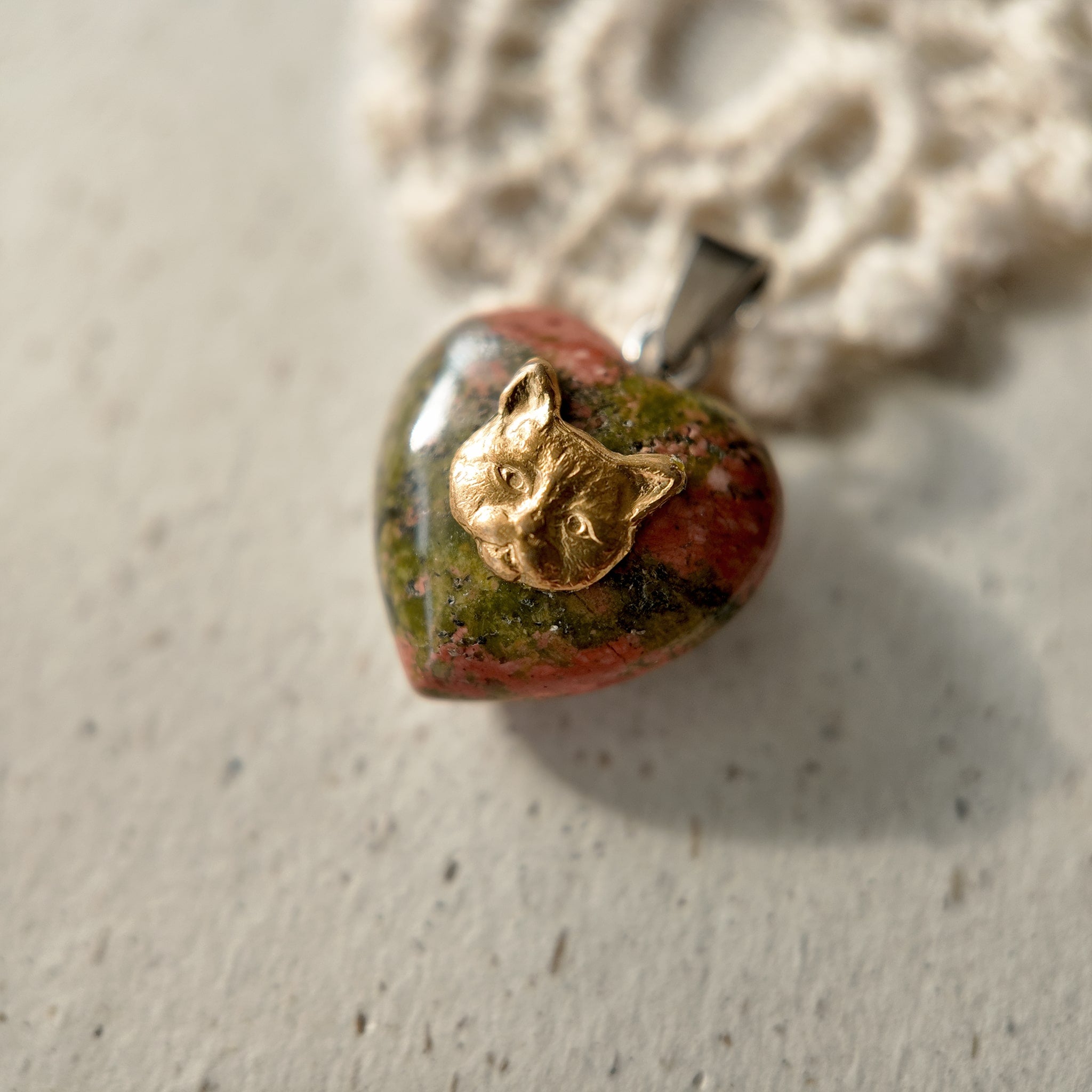 Natural stone charm, uniquely shaped stones, naturally carved, with distinctive colors. Heart-shaped stone.