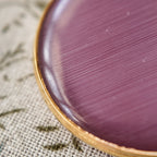 White stripes on a pink cat's eye stone