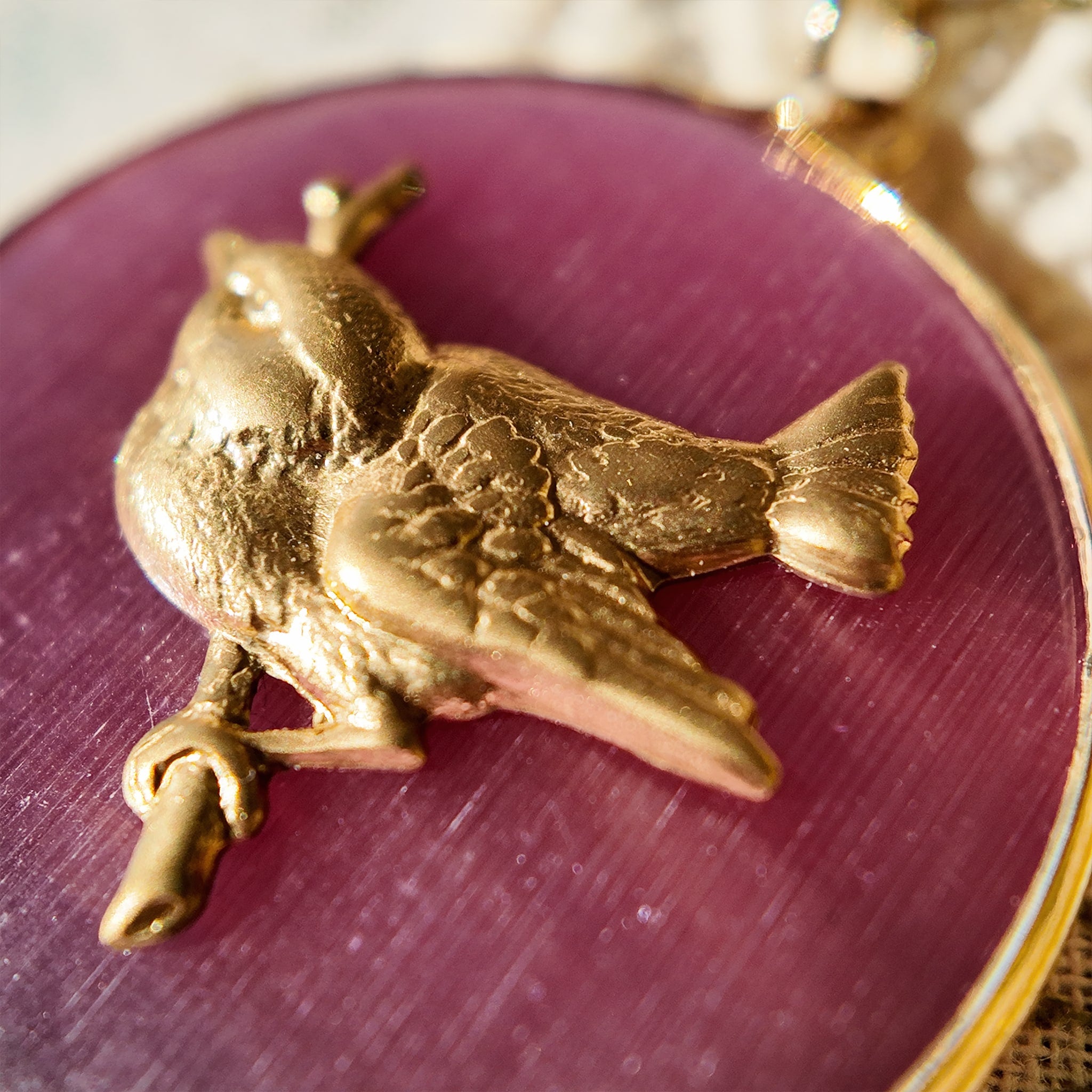 Figurative pendant necklace featuring a bird design; the plump bronze bird pendant is a striking element. Animal jewelry, bird jewelry pendant.