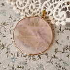 Round rose quartz pendant, a must-have for crystal lovers. Rose quartz.