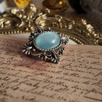 The bottom view of the imitation opal brooch shows the vintage brooch viewed from below.