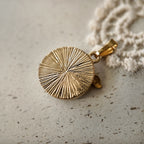 Natural tiger's eye pendant with a gold-plated backplate, striped engraving decoration, and a unique gold design; a lucky charm.