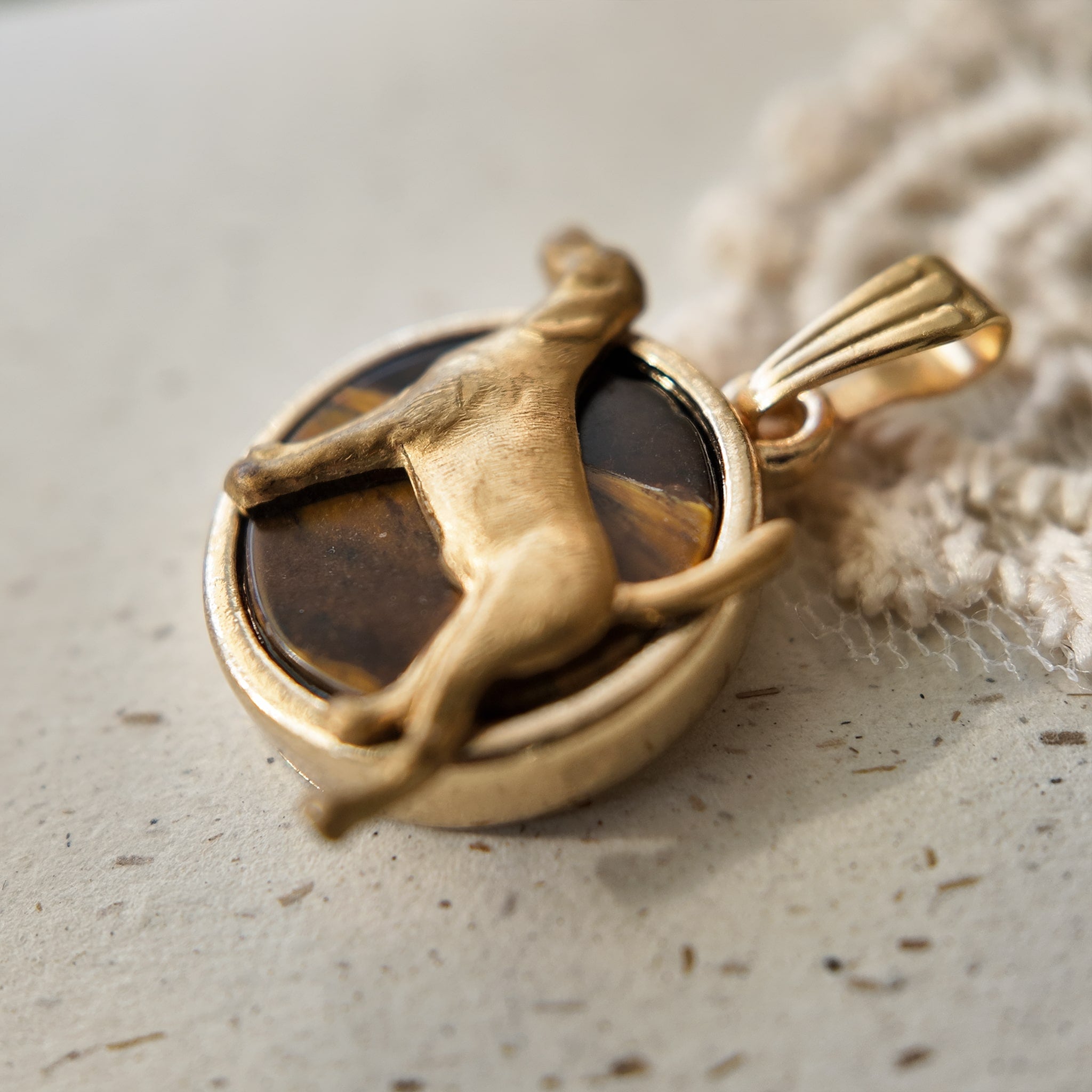 Dog jewelry, lucky charm. Labrador-themed items, brass puppy pendant. Cute and vintage style.