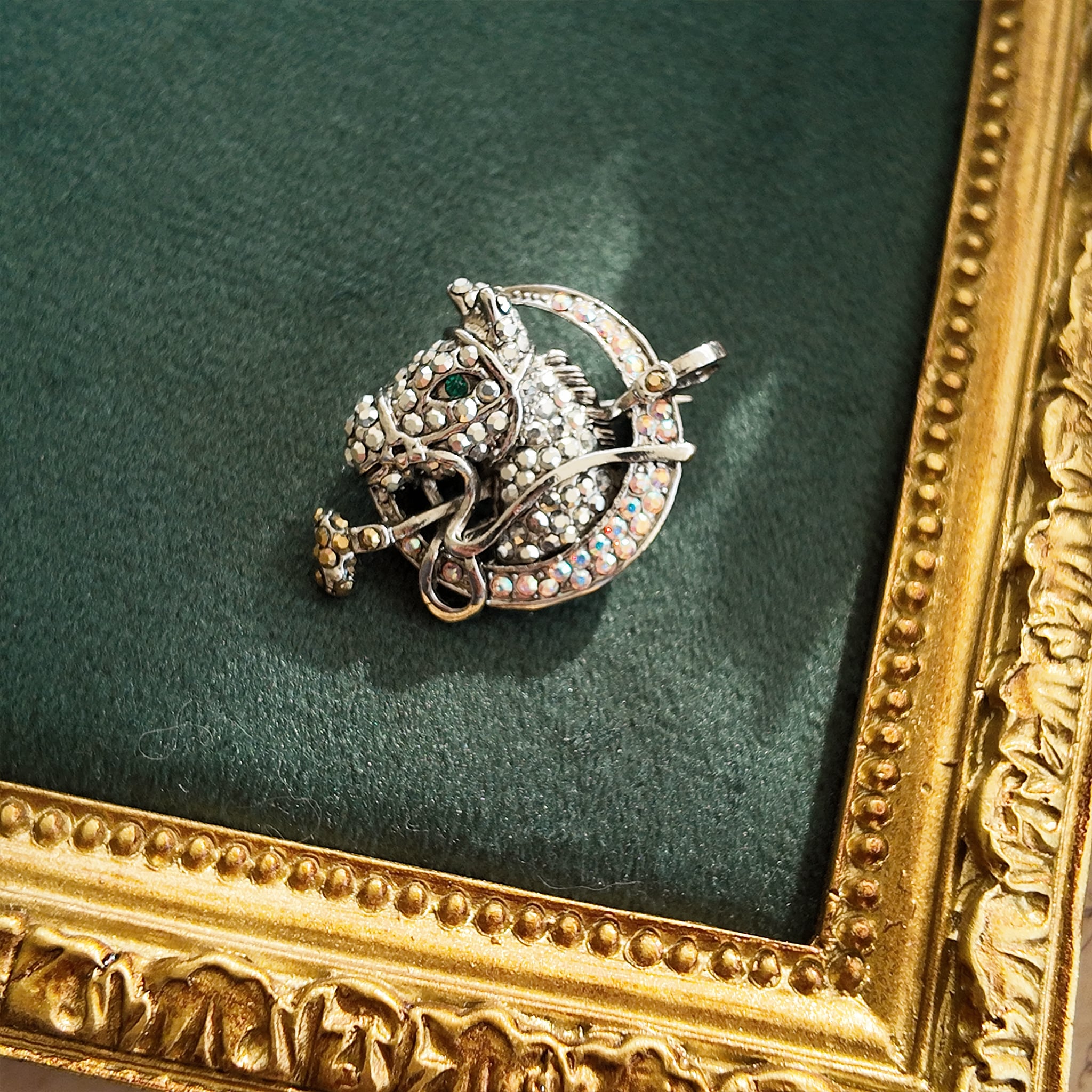 This exquisite polo brooch is from Butler & Wilson and is a genuine medieval brooch. It features a vintage horse motif and is set with rhinestones and Marseille stones.