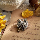 AB rhinestone brooch, featuring polo elements and a sporting symbol; small and exquisite.