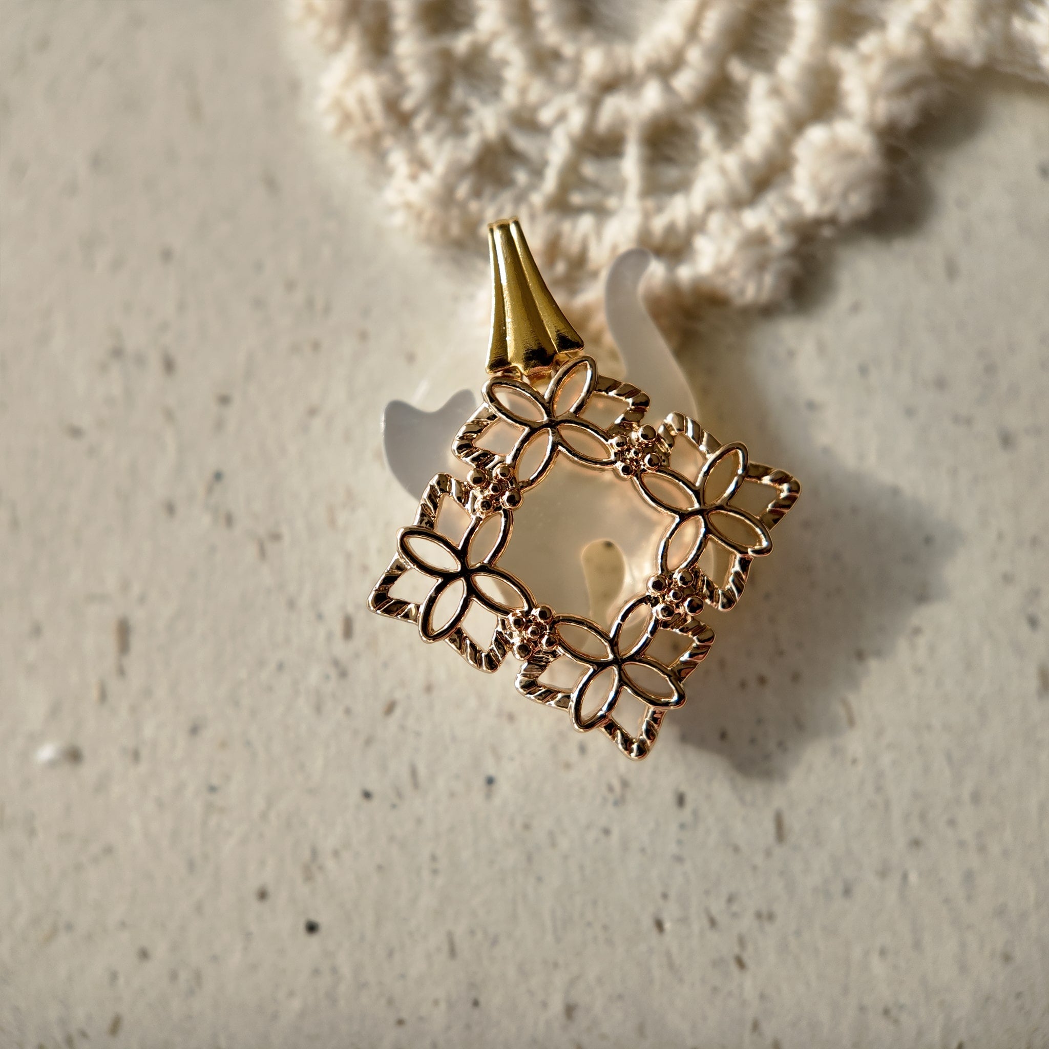 Vintage openwork gold pendant, retro jewelry, shimmering gold.
