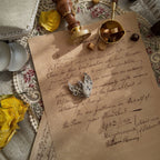 An elegant white swan brooch from the brand A&S, featuring a design with fully engraved diamonds and rubies for the eyes.