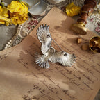 Bird-themed jewelry, owl brooch. Vintage silver jewelry, owl design.