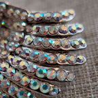 AB iridescent rhinestone details, rhinestone cutting and setting techniques from the last century.