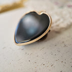 Black heart-shaped glass pendant, black jewelry, vintage heart design.