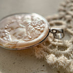 Vintage Cameo jewelry, featuring a young girl's profile, hand-carved, and made of pearls.