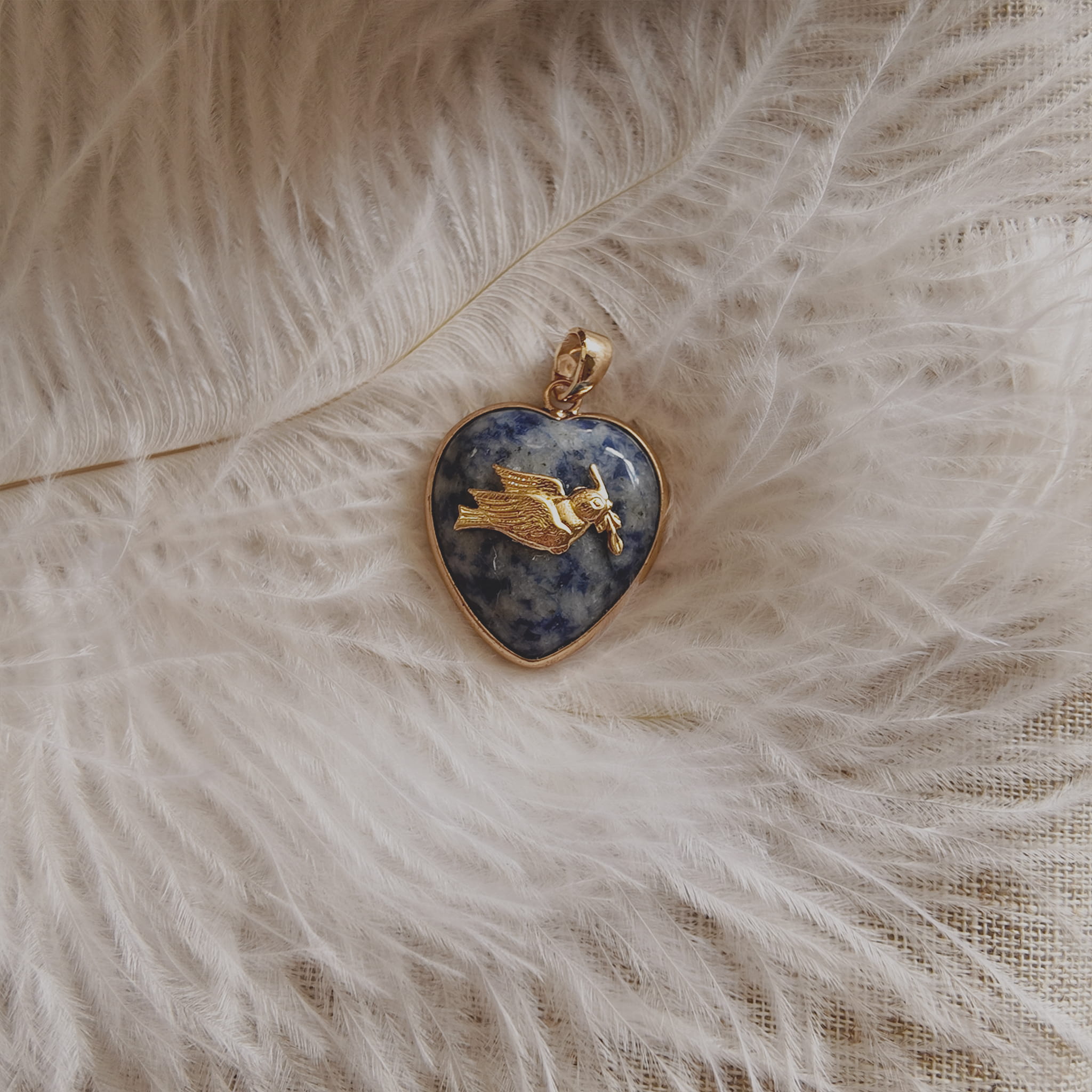 The Character Arc distinct packaging showcasing the pendant as a perfect gift for harmony and hope.