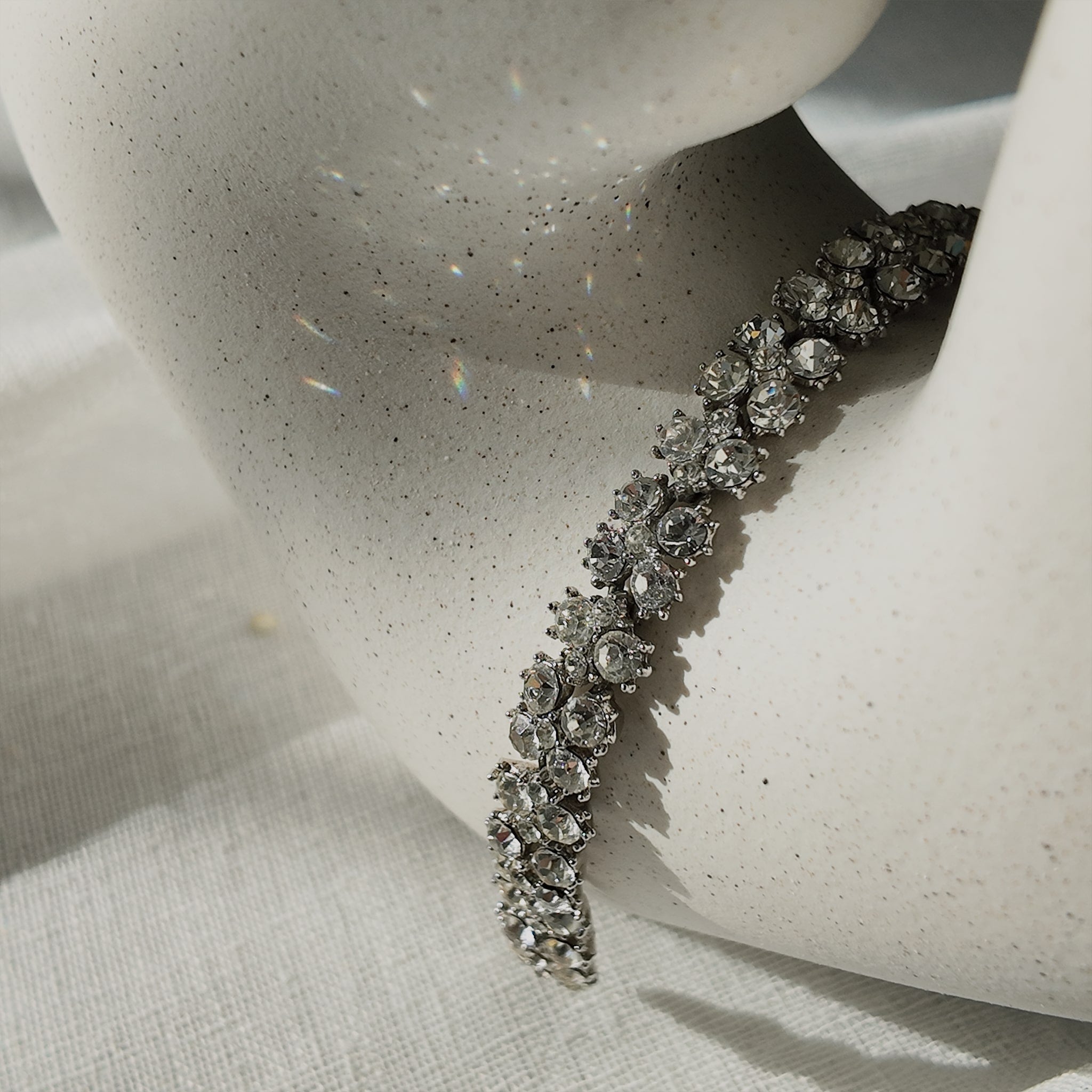 A macro shot detailing the pristine, front-facing condition of the brilliant-cut Austrian crystals and the secure, hand-set prongs on this investment-grade Trifari piece.