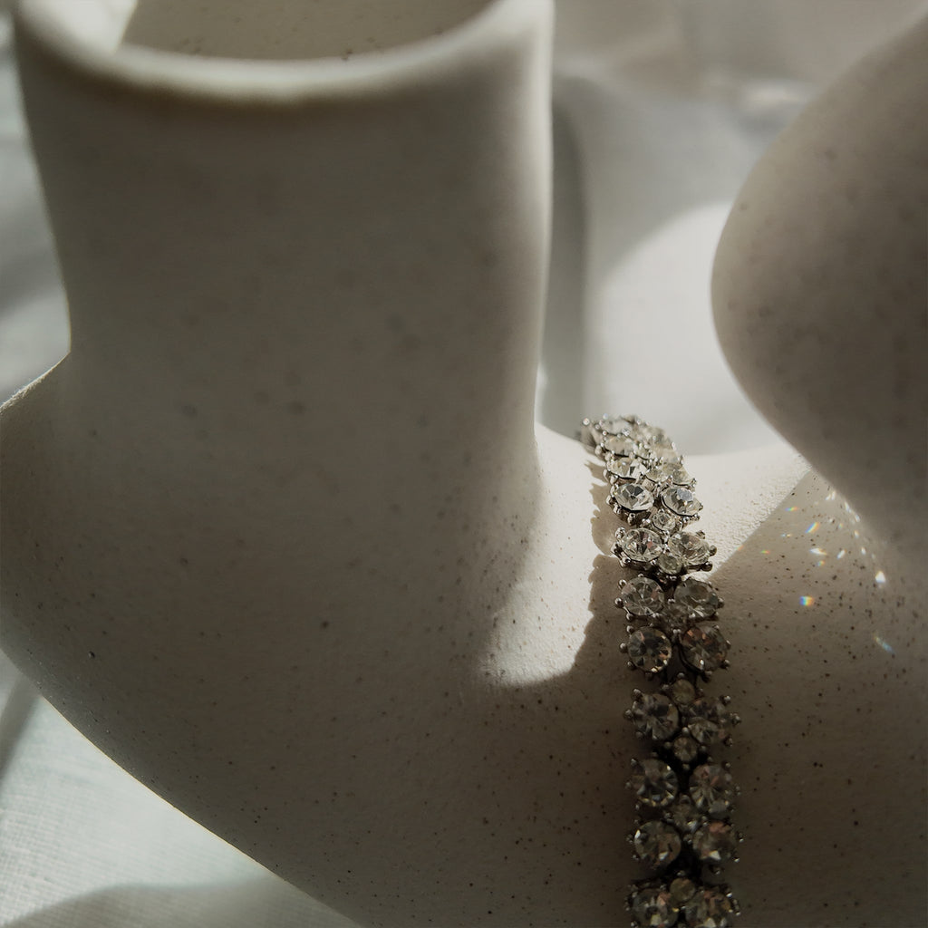 A macro shot detailing the pristine, front-facing condition of the brilliant-cut Austrian crystals and the secure, hand-set prongs on this investment-grade Trifari piece.