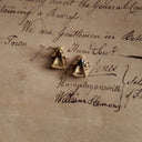 The reverse side of the vintage Avon earrings, honestly showing some minor, gentle tarnishing consistent with their authentic 1970s age.