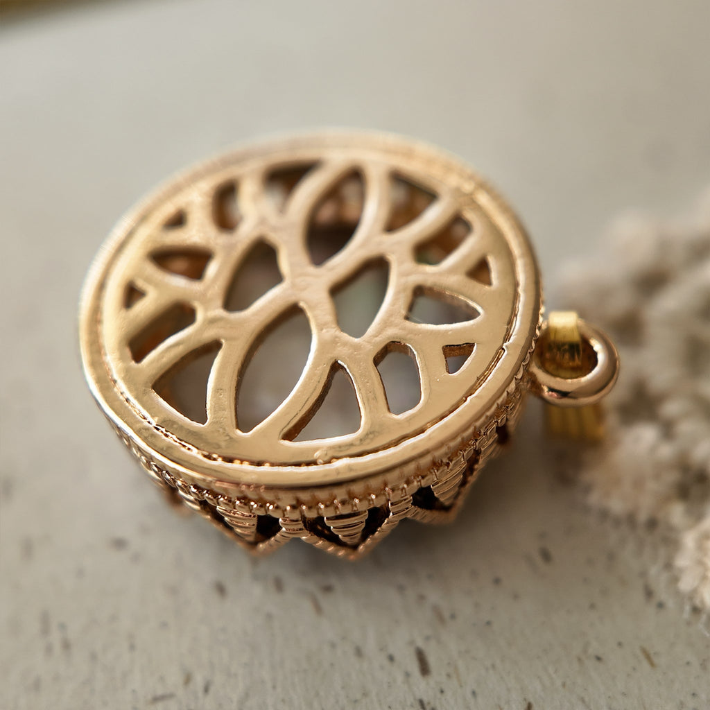 The reverse side of the spirit animal-inspired "Bear Who Dreamed of Stars" pendant, showcasing the clean, textured bezel and the handcrafted assembly.