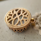 The reverse side of the spirit animal-inspired "Bear Who Dreamed of Stars" pendant, showcasing the clean, textured bezel and the handcrafted assembly.