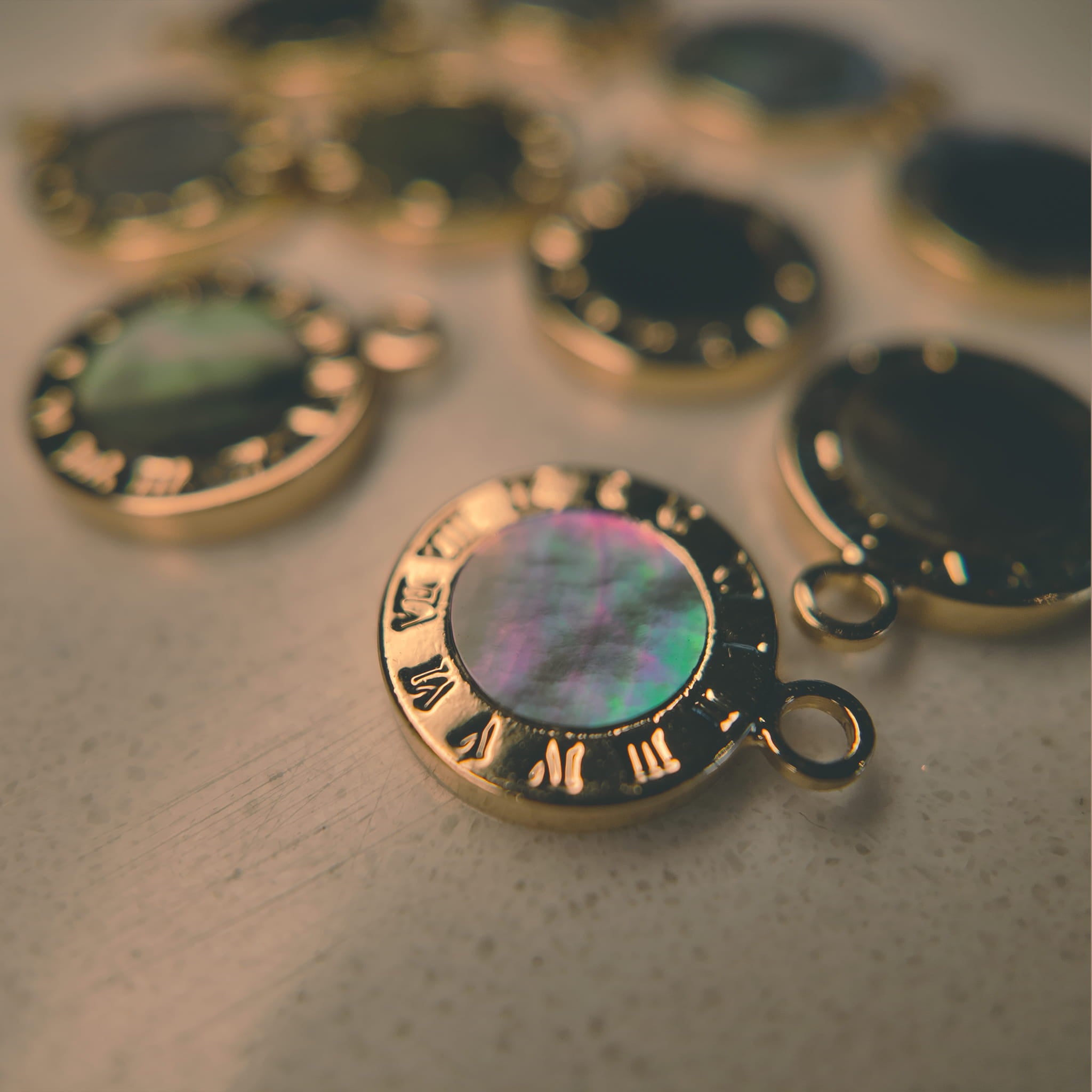 The "Mermaid's Tear" charm styled on a piece of black silk to emphasize its "beauty in sadness" aesthetic and its identity as an oceanic relic