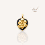 Front view of The Bloom in the Dark pendant featuring a sparkling midnight blue sandstone heart with a large brass poppy.