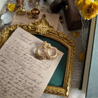 The "Free Spirit" Trifari earrings styled on a denim jacket to emphasize their "effortlessly cool" and versatile aesthetic, perfect for everyday bohemian luxury.