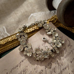 A macro shot detailing the pristine, front-facing condition of the brilliant-cut Austrian crystals, which show no signs of aging from the front.