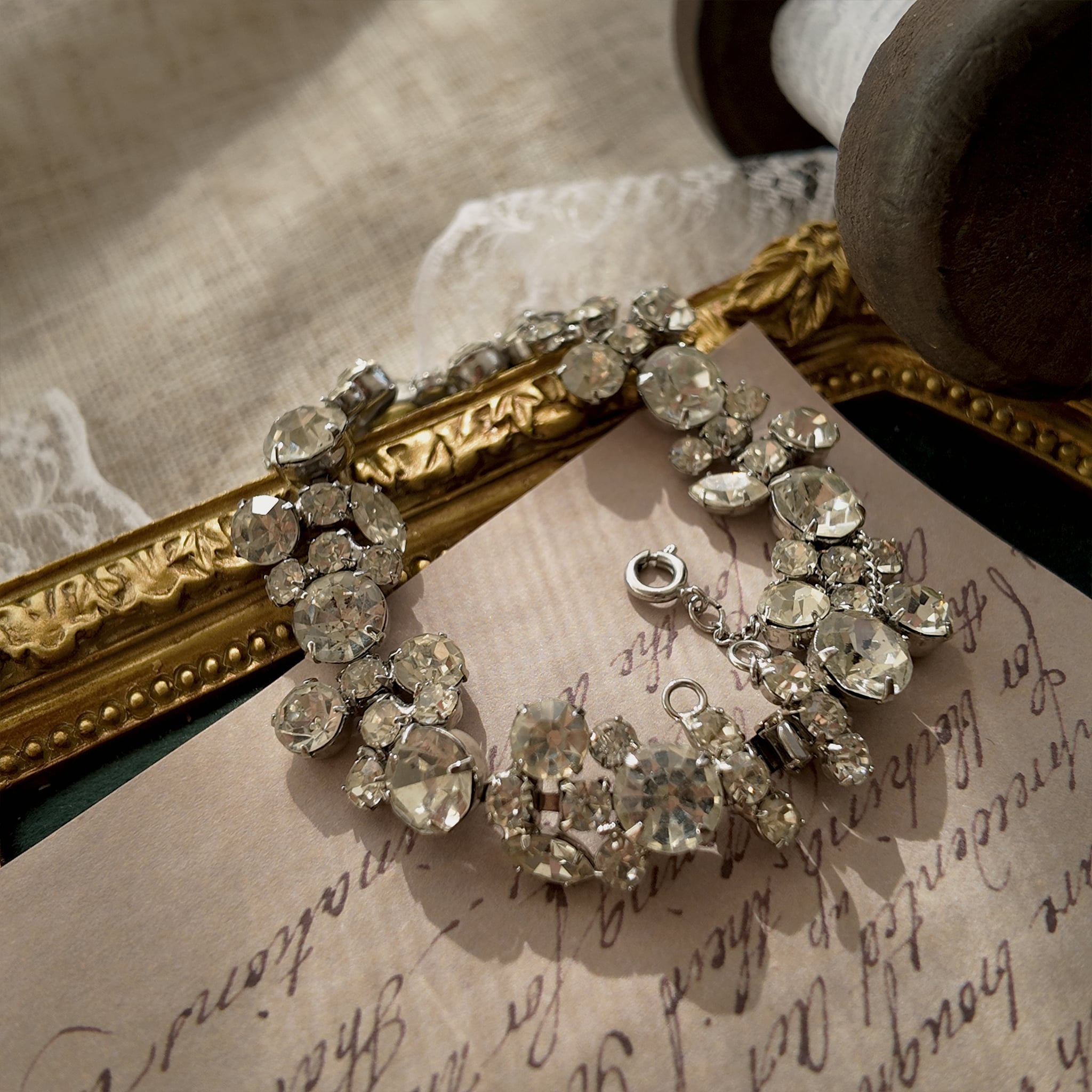 A macro shot detailing the pristine, front-facing condition of the brilliant-cut Austrian crystals, which show no signs of aging from the front.