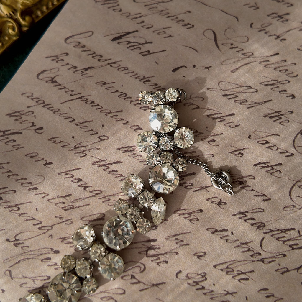 A macro shot detailing the pristine, front-facing condition of the brilliant-cut Austrian crystals, which show no signs of aging from the front.