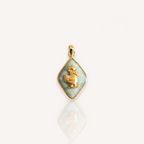 Front view of The Dapper Duck pendant featuring a vintage brass duck with a scarf on a pale sky blue Amazonite rhombus.