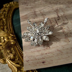 A macro shot detailing the exceptional fire and brilliance of the ice-clear Austrian crystals, which rival the sparkle of real diamonds on this investment-grade brooch.