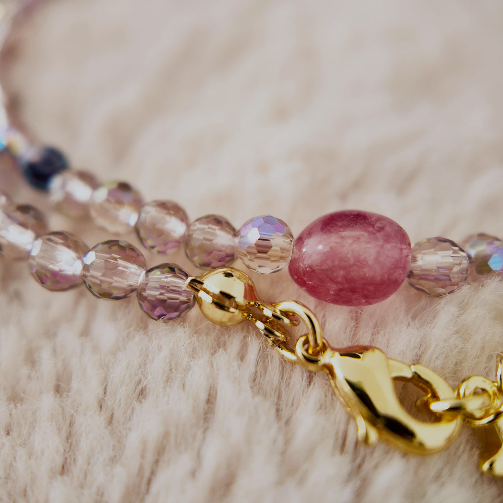 The reverse side of the "Dream Weaver" necklace, showing the clean, gold-tone clasp and the 2-inch extender chain for an adjustable fit.