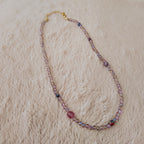 The "Dream Weaver" necklace styled on dark velvet to emphasize its "trail of stardust" and "twilight hues" aesthetic, a perfect piece of magical, ethereal jewelry.