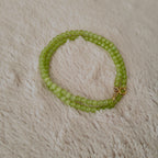 The reverse side of the handmade choker, showing the simple and secure gold-tone clasp and extender chain.