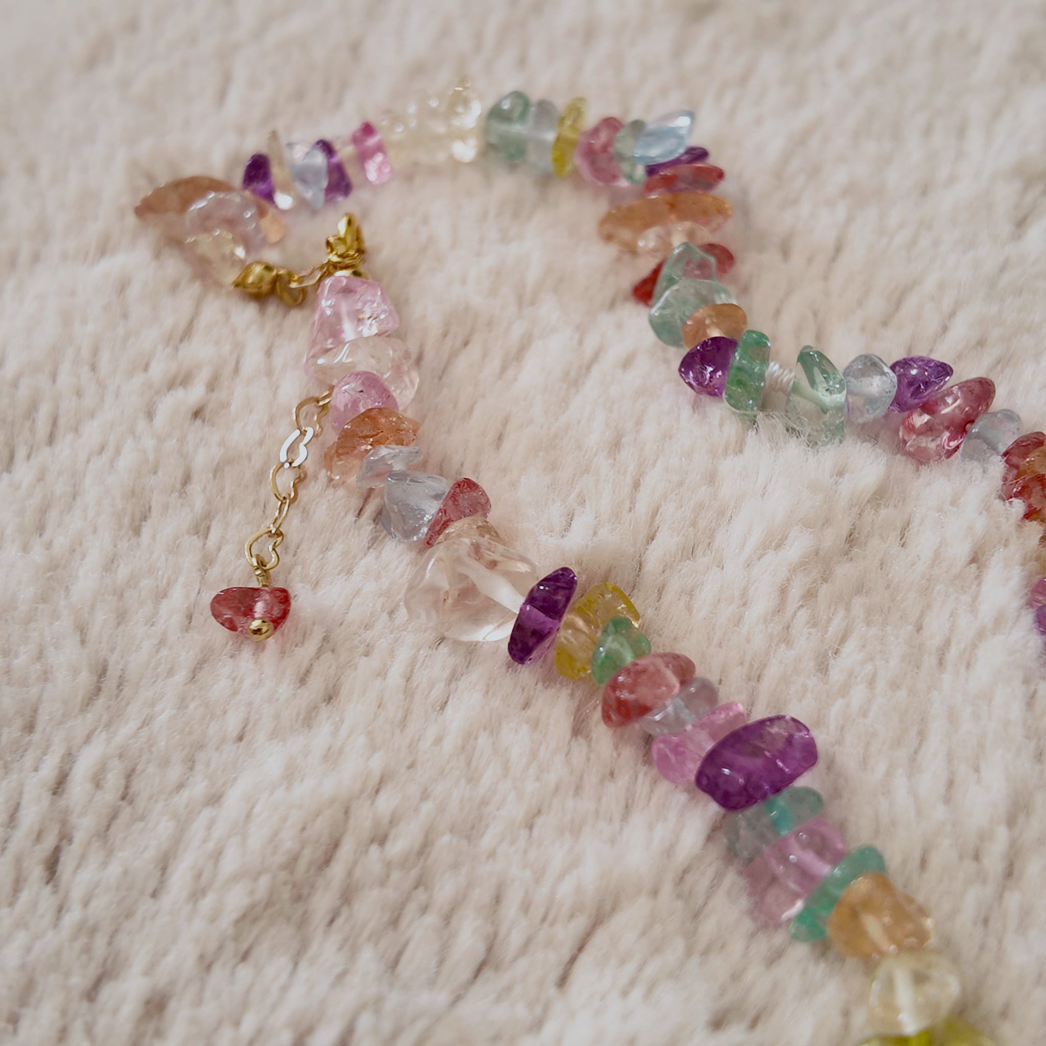 The reverse side of the handmade Y2K necklace, showing the secure gold-tone clasp and extender chain for an adjustable fit.